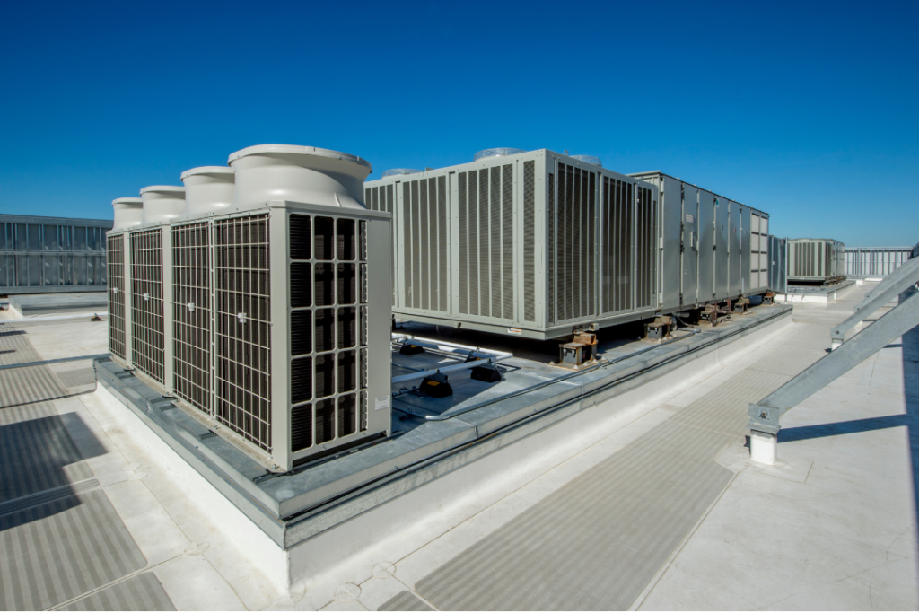 Large rooftop commercial HVAC units installed for efficient heating and cooling in a commercial building.